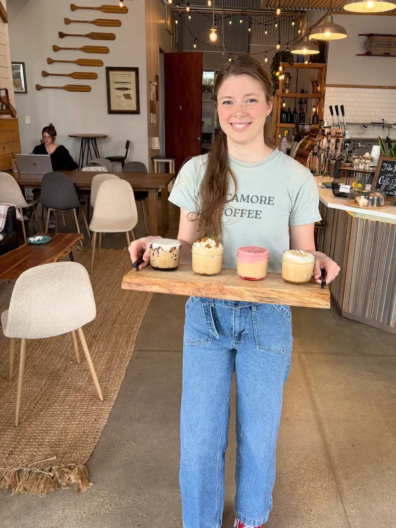 A barista serving a seasonal coffee flight