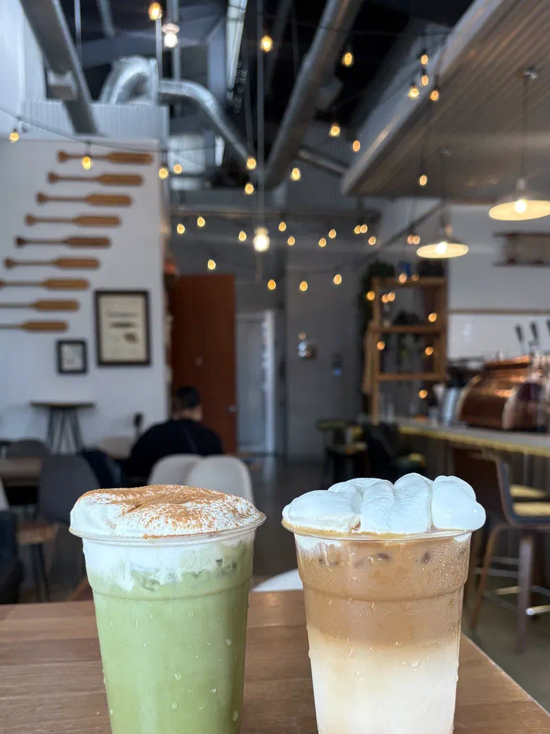 Iced lattes lined up on the bar